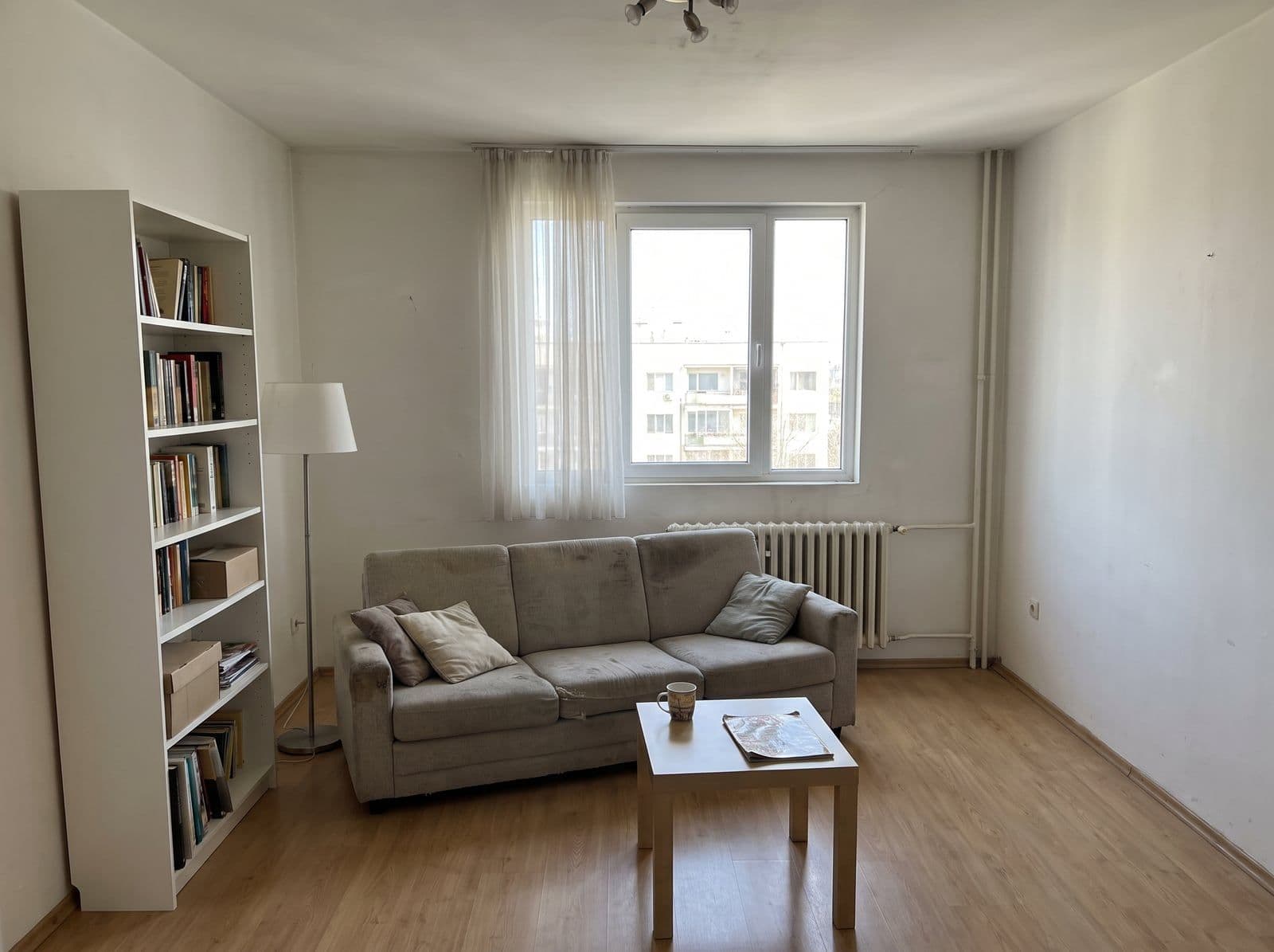 The original photo with an old sofa and table